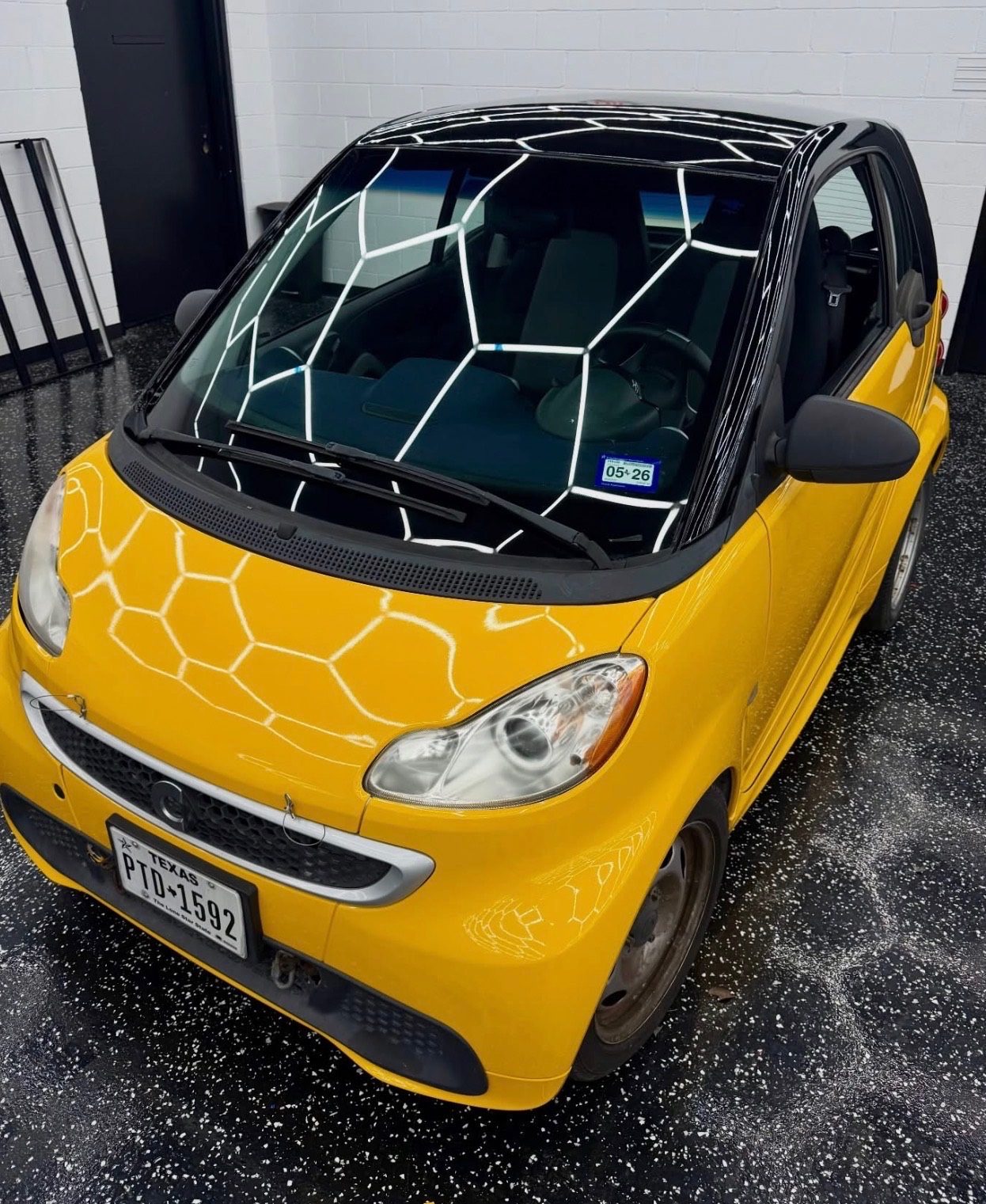 Yellow Smart ForTwo ceramic tint at Sleepr Studio College Station TX