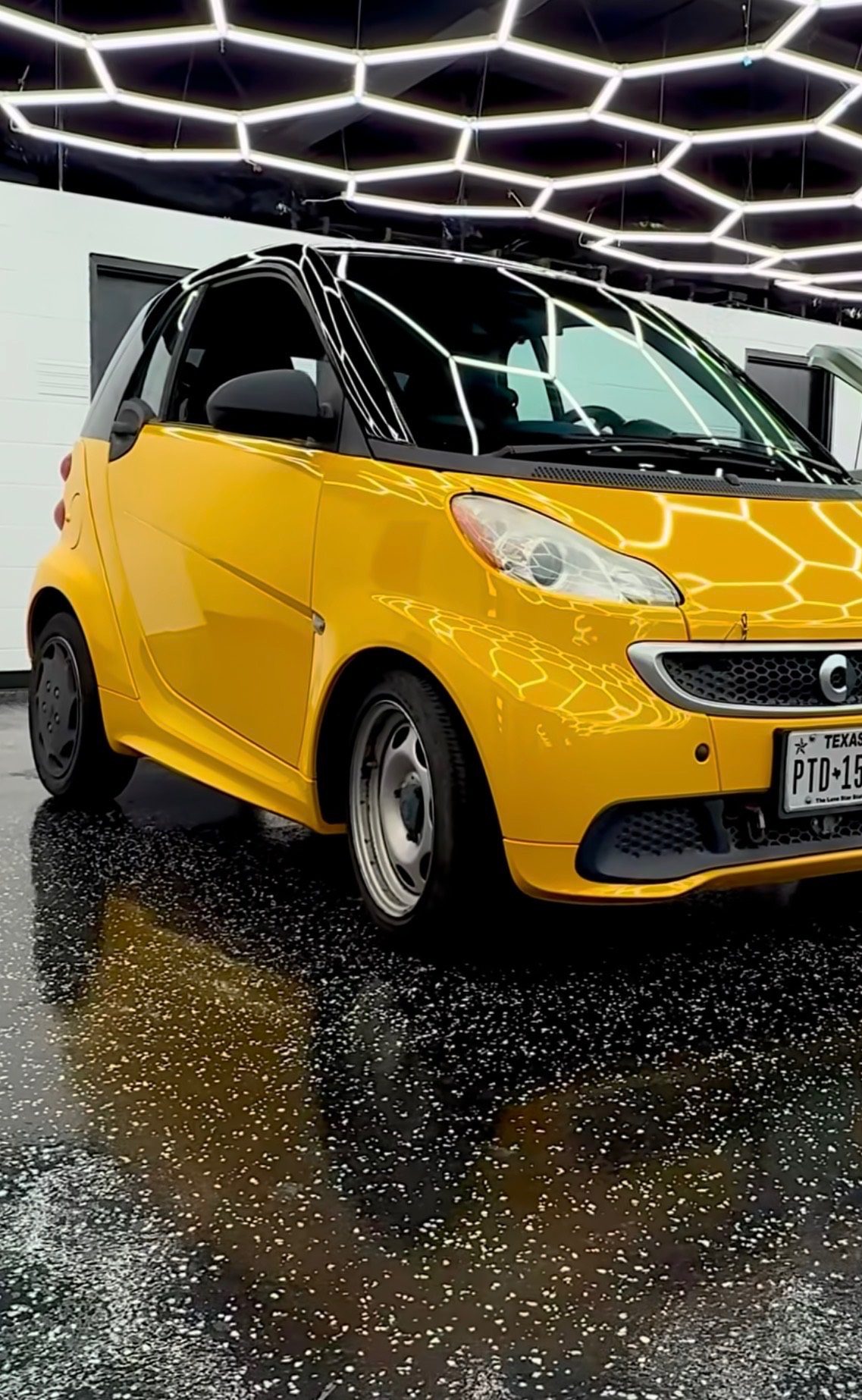 Yellow Smart ForTwo ceramic tint at Sleepr Studio College Station TX